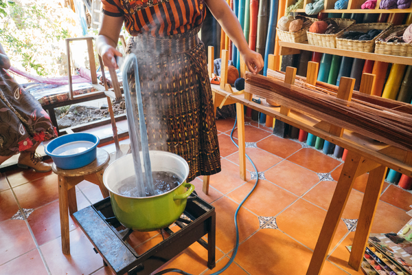 Guatemalan, Casa Flor Ixcaco, weaving artisan dying yarn