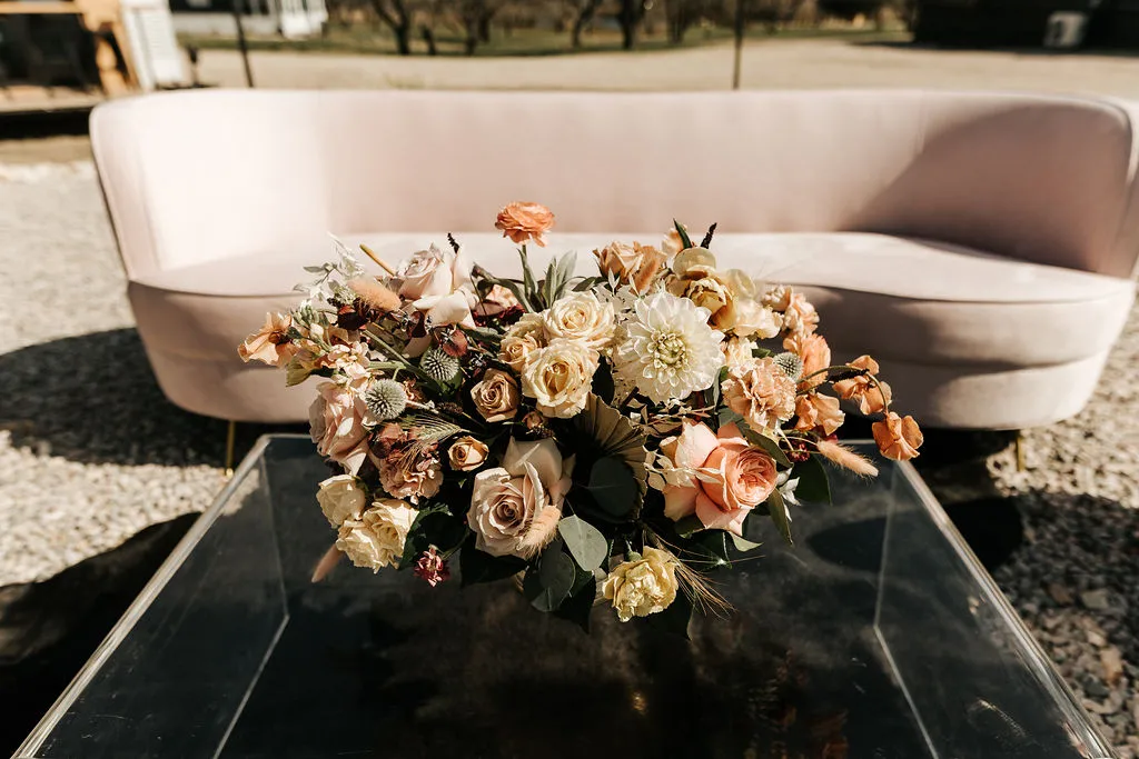 bouquet and pink velvet couch