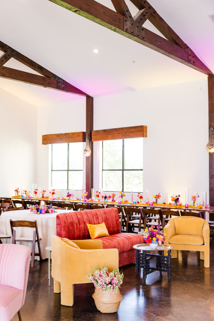 an example of vibrant sunset colors used in a wedding lounge featuring a sofa and two armchairs