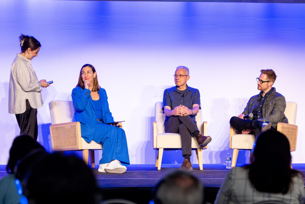 a panel of experts in modern chairs at a corporate event