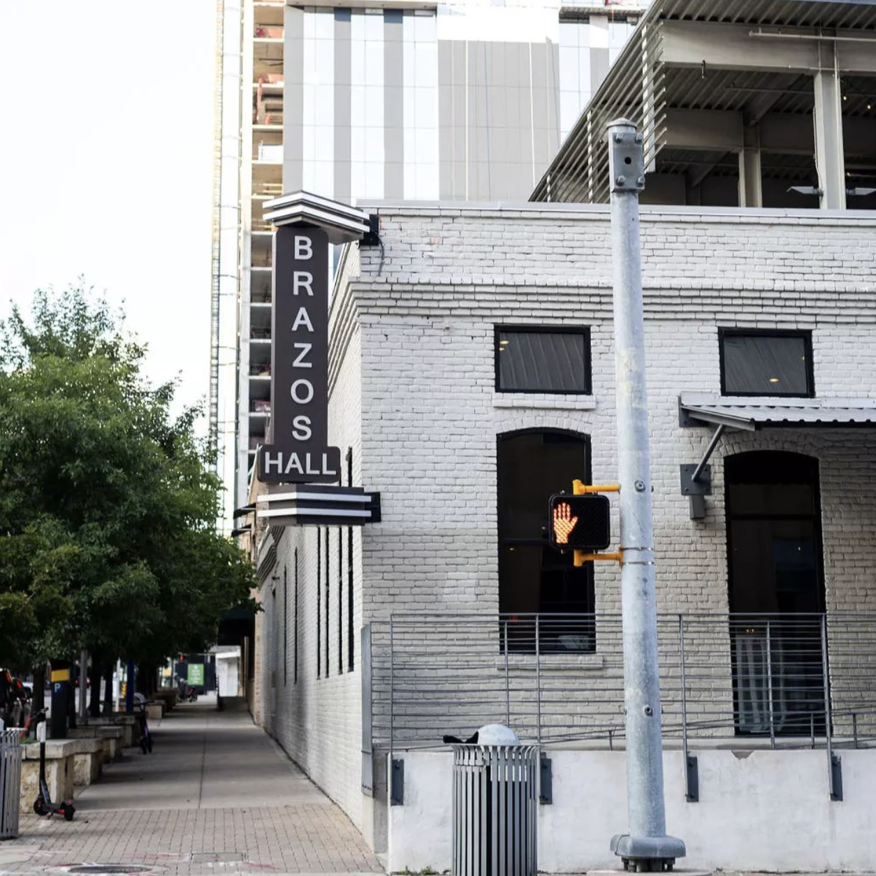 white brick exterior of Brazos Hall, a corporate event venue in downtown Austin, TX