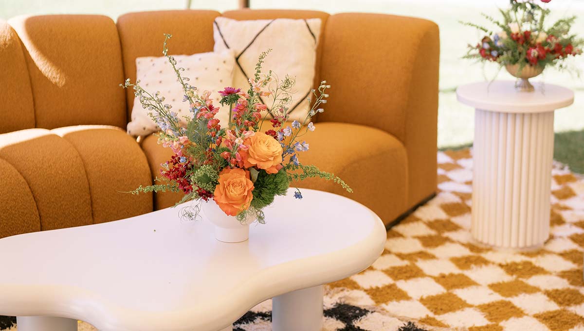 orange and green wedding furniture at Camp Lucy venue